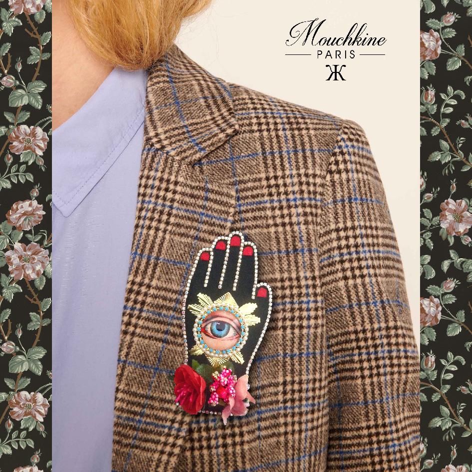 mouchkine jewelry couture and sophisticated hand brooch with antique eye, surrounded by flowers