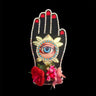 mouchkine jewelry couture and sophisticated hand brooch with antique eye, surrounded by flowers