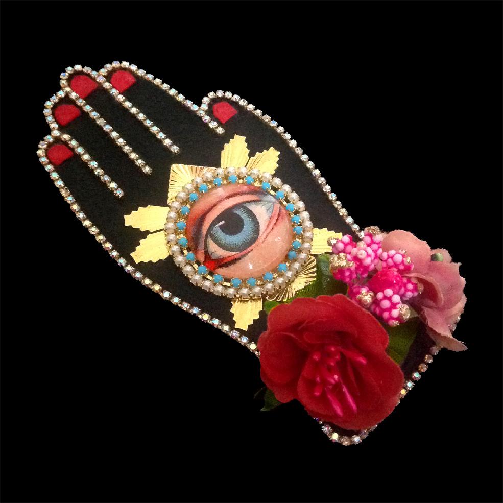 mouchkine jewelry couture and sophisticated hand brooch with antique eye, surrounded by flowers